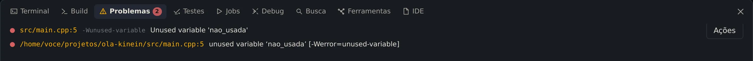 A aba Problemas com dois itens na linha 5 do main.cpp: o aviso do clangd, Unused variable nao_usada, com o botão Ações, e o erro do compilador, unused variable nao_usada [-Werror=unused-variable]